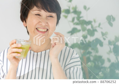 Senior woman juice smoothie 88706252