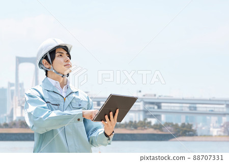 Construction workers against the backdrop of the city Construction workers against the backdrop of the city 88707331