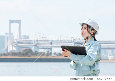 Construction workers against the backdrop of the city Construction workers against the backdrop of the city 88707332