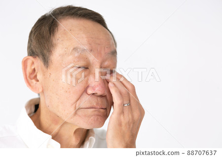 Senior male face around the eyes 88707637