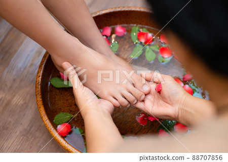 Beautiful female feet at spa salon 88707856
