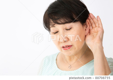Senior woman deafness hearing 88708735