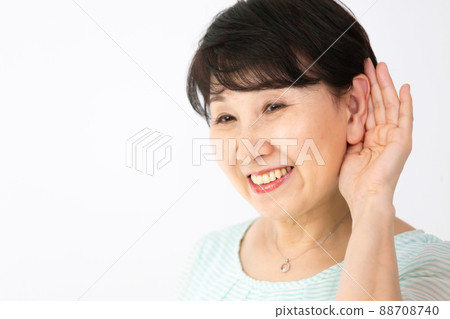 Senior woman deafness hearing 88708740