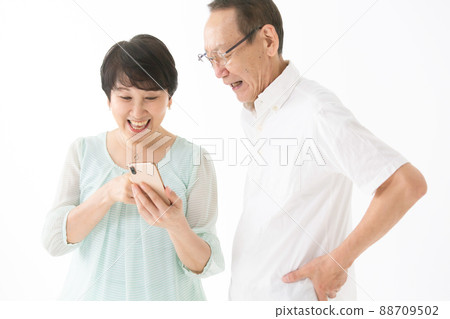 Senior couple smartphone fun Senior couple smartphone fun 88709502