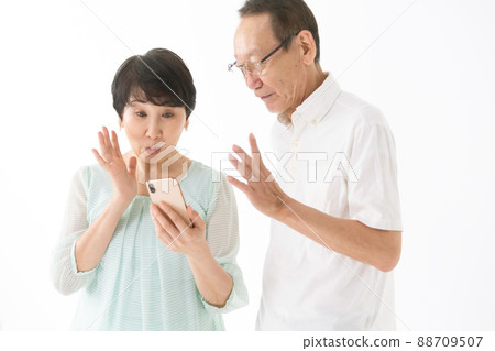 Senior couple smartphone fun 88709507