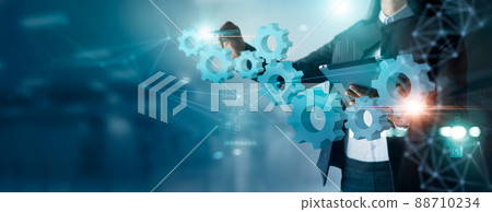 Businesswoman drawing connect pieces of gears wheel to success on network background, Development, Teamwork and partnership  concept 88710234