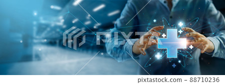 Man hold virtual medical network connection icons. Covid-19 pandemic develop people awareness and spread attention on their healthcare, rising growth in hospital and health insurance business. 88710236