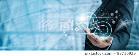 Businessman hold circular economy icon. Sustainable strategy approach to eliminate waste and pollution for future growth of business and environment, design to reuse and renewable material resources.. 88710929