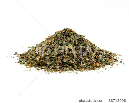 Some chopped, mixed herbs isolated on white background with copy space for text, images. Spices. Packaging concept. Close-up, side view. Some chopped, mixed herbs isolated on white background with copy space for text, images. Spices. Packaging concept. Close-up, side view. 88712998