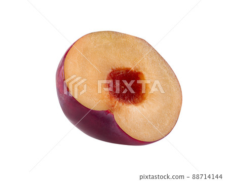 Half of smooth-skinned, purple plum fruit without kernel isolated on white background with copy space for text or images. Side view. Close-up. 88714144
