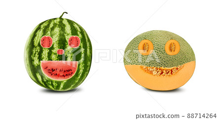 Smile emoticons carved out in watermelon and melon, isolated on white with copy space for text or images. Red and yellow flesh with seeds. Close-up. 88714264