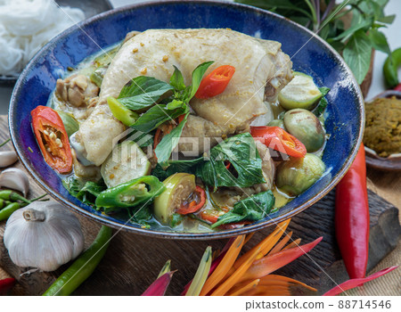 Green curry with Chicken and Green-white varieties of Thai eggplants (Kaeng khiao wan) in Ceramic bowl. Green curry with Chicken and Green-white varieties of Thai eggplants (Kaeng khiao wan) in Ceramic bowl. 88714546