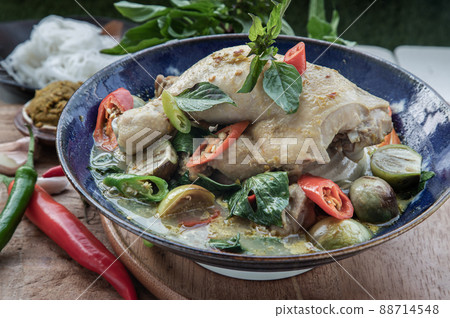 Green curry with Chicken and Green-white varieties of Thai eggplants (Kaeng khiao wan) in Ceramic bowl. Green curry with Chicken and Green-white varieties of Thai eggplants (Kaeng khiao wan) in Ceramic bowl. 88714548