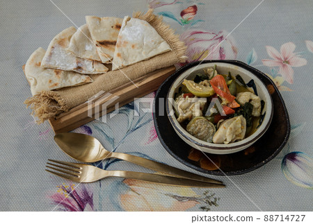 Homemade pita bread served with Green curry chicken. Homemade pita bread served with Green curry chicken. 88714727