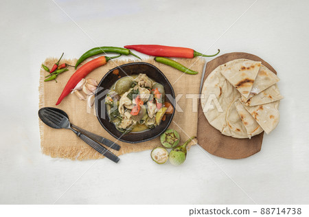 Homemade pita bread served with Green curry chicken. Homemade pita bread served with Green curry chicken. 88714738