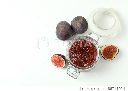 Jar with fig jam and ingredients on white background 88715924