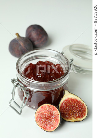 Jar with fig jam and ingredients on white background 88715926