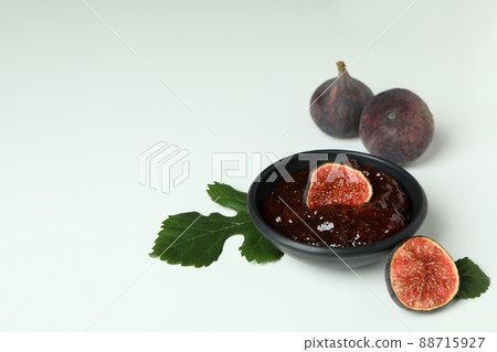 Bowl with fig jam and ingredients on white background 88715927
