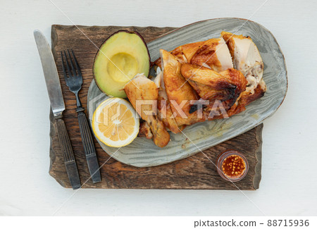 Grilled chicken or Roasted chicken with Avocado and Lemon cut in half serve with Sweet chili sauce. Grilled chicken or Roasted chicken with Avocado and Lemon cut in half serve with Sweet chili sauce. 88715936
