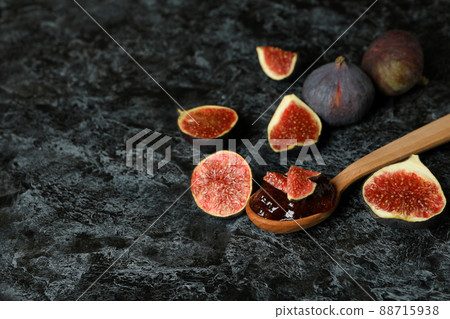 Spoon with fig jam and ingredients on black smokey background Spoon with fig jam and ingredients on black smokey background 88715938
