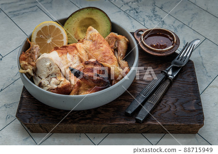 Grilled chicken or Roasted chicken with Avocado and Lemon cut in half serve with Sweet chili sauce. Grilled chicken or Roasted chicken with Avocado and Lemon cut in half serve with Sweet chili sauce. 88715949
