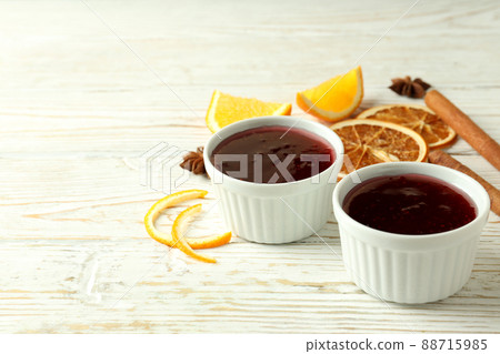 Cranberry sauce and ingredients on white wooden background 88715985