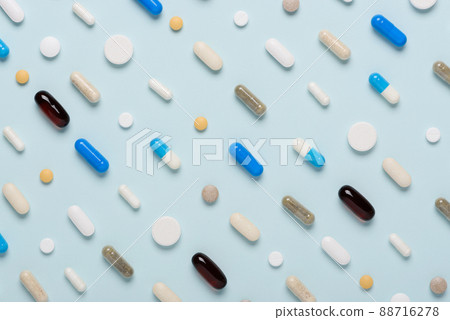 Medicine pills drugs pattern on blue background top view Medicine pills drugs pattern on blue background top view 88716278