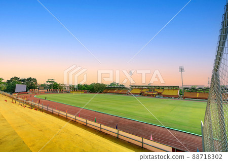 Empty yellow grandstand for fans cheering at football stadium Empty yellow grandstand for fans cheering at football stadium 88718302