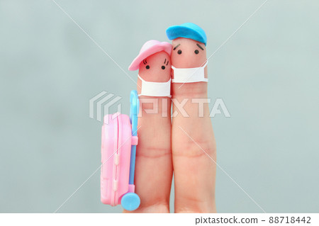 Fingers art of happy family with face mask. Man and woman going on vacation. 88718442