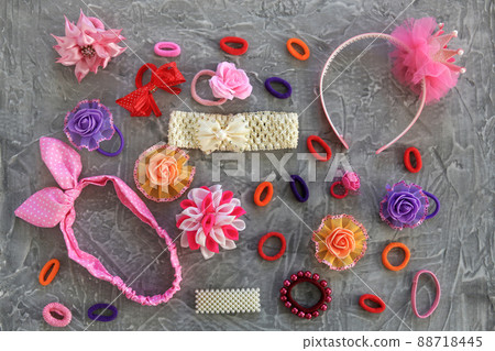 Different hair clips on gray background. Flat lay. Top view. Different hair clips on gray background. Flat lay. Top view. 88718445