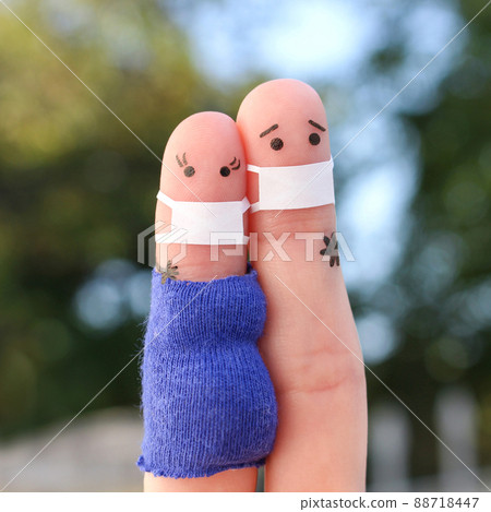 Fingers art of couple in medical mask from COVID-2019. Woman is pregnant. Fingers art of couple in medical mask from COVID-2019. Woman is pregnant. 88718447