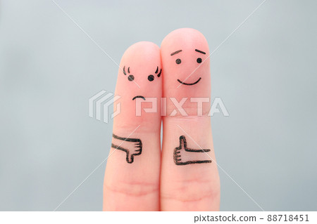 Fingers art of couple. Woman showing thumb down and man showing thumb up. Fingers art of couple. Woman showing thumb down and man showing thumb up. 88718451