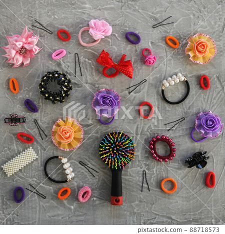 Different hair clips on gray background. Flat lay. Top view. 88718573
