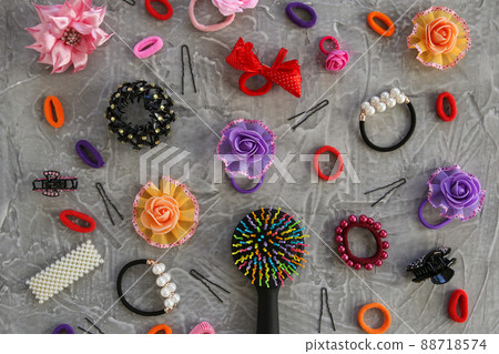 Different hair clips on gray background. Flat lay. Top view. 88718574