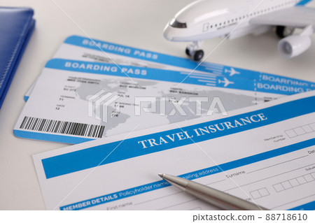 Airplane tickets, empty travel insurance form with pen, fill in information 88718610