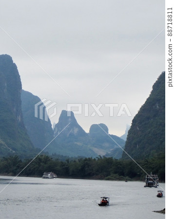 Mt. Fuji-shaped mountain descends from Guilin, China Mt. Fuji-shaped mountain descends from Guilin, China 88718811
