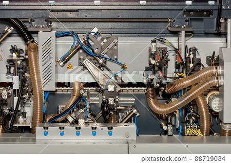 A fragment of the internal system of a modern woodworking machine with mechanisms for controlling and removing sawdust. 88719084