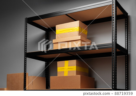Rack shelves with paper boxes in warehouse. 88719359