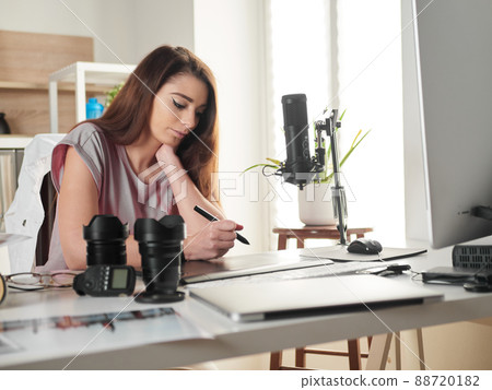 Graphic designer photographer working in home office Graphic designer photographer working in home office 88720182