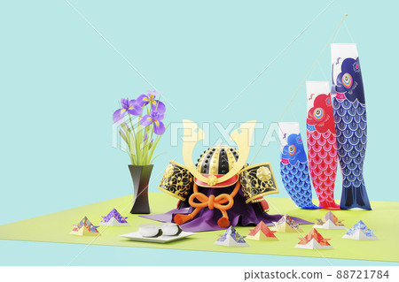 Helmet decoration, carp streamer and Kashiwa mochi placed on a light blue background / Children's Day image with a copy space 88721784