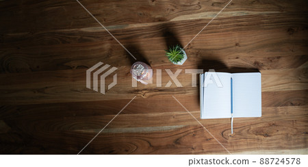 Blank open notepad on wooden desk 88724578
