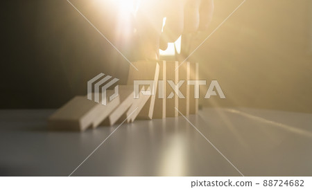 Stopping domino effect with a bright light flare from behind 88724682