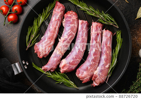 Bird chicken giblets gizzards stomachs, on old dark rustic table background, top view flat lay Bird chicken giblets gizzards stomachs, on old dark rustic table background, top view flat lay 88726720