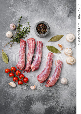 Bird chicken giblets gizzards stomachs, on gray stone table background, top view flat lay, with copy space for text 88726722