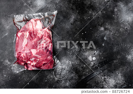 Lamb meat pack ready for cooking, on black dark stone table background, top view flat lay, with copy space for text Lamb meat pack ready for cooking, on black dark stone table background, top view flat lay, with copy space for text 88726724