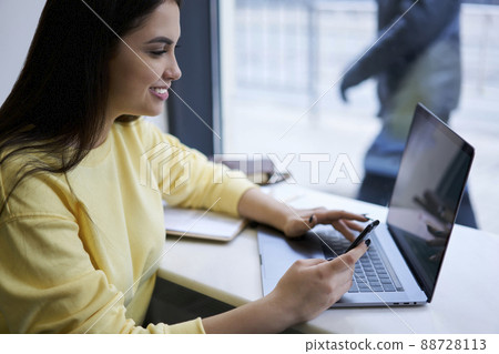 Prosperous hipster girl using technology on remote job 88728113