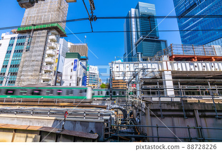 Redevelopment work is underway at Shibuya Station, a cityscape of Tokyo in Japan. (You can see Shibuya Hikarie in the back) 88728226