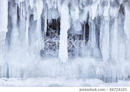 Frozen splash water on Baikal lake. Abstract winter background. Amazing scenery with frozen water Frozen splash water on Baikal lake. Abstract winter background. Amazing scenery with frozen water 88728283