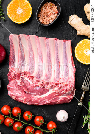 Frenched rack of lamb Mutton, on black dark stone table background, top view flat lay 88728804