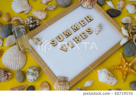 Composition sheet white paper text SUMMER VIBES, seashells, pebbles, mockup on yellow background. Blank, top view, still life, flat lay. sea vacation travel concept tourism and resorts. 88729550